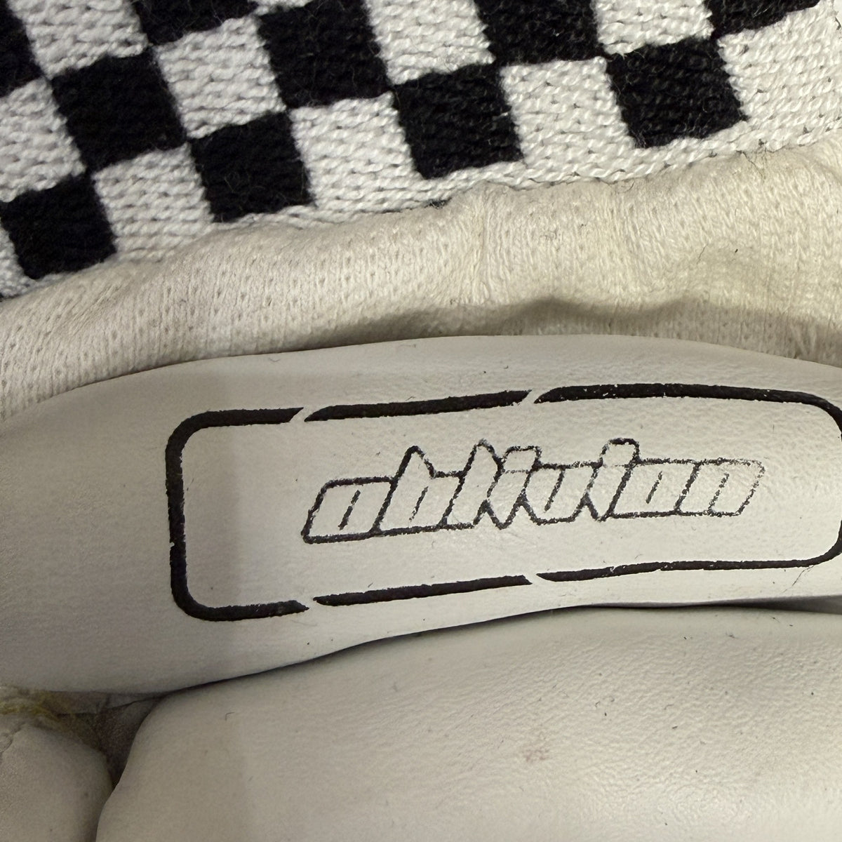 Gray-Nicolls Oblivion logo close-up on the glove with black and white checkered cuff