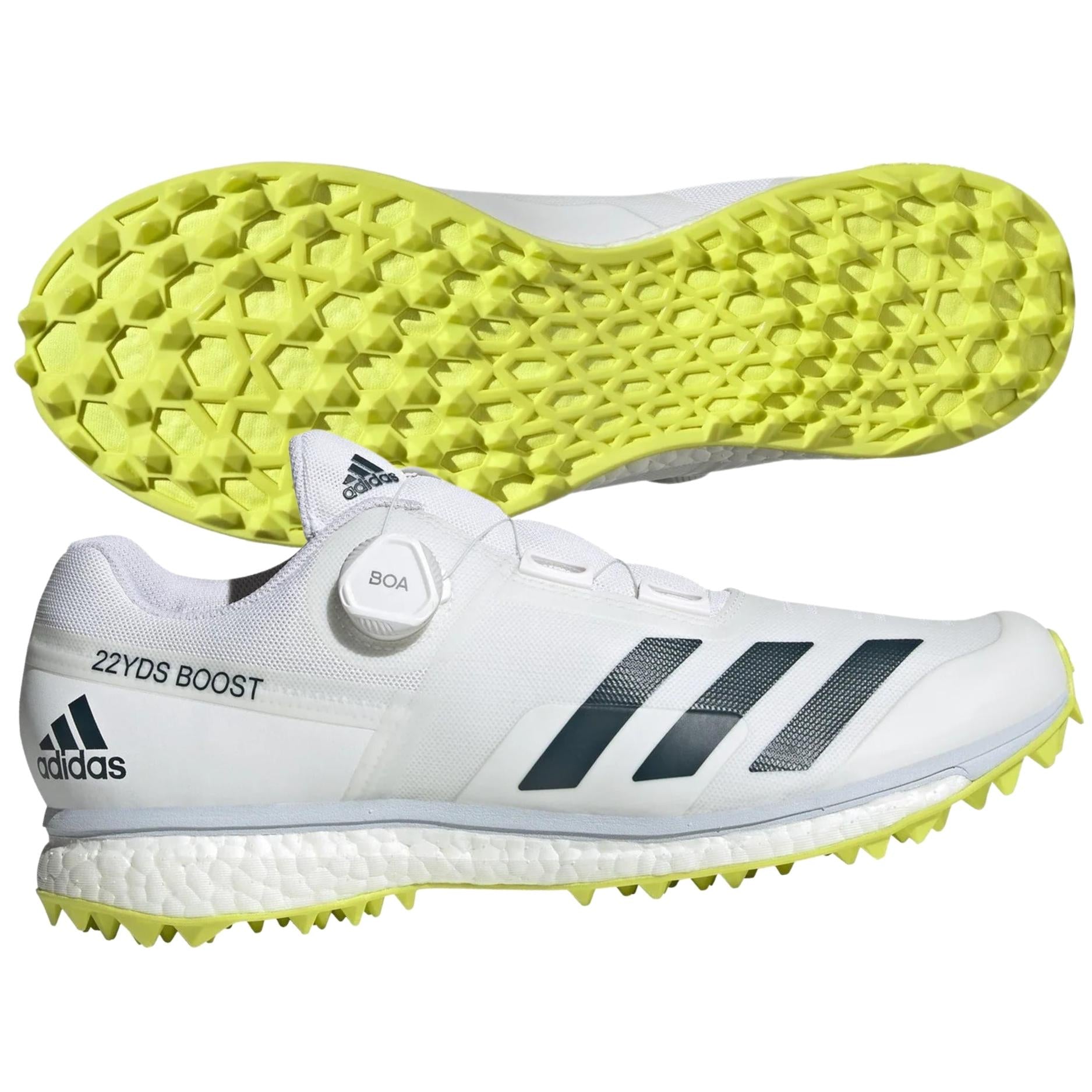 1st-Bottom-and-Side-View of Adidas 22YDS Boost Cricket Shoes shown from the bottom and side, highlighting the ultra-sharp TPU outsole with traction lugs and ergonomic design for optimal grip and stability.